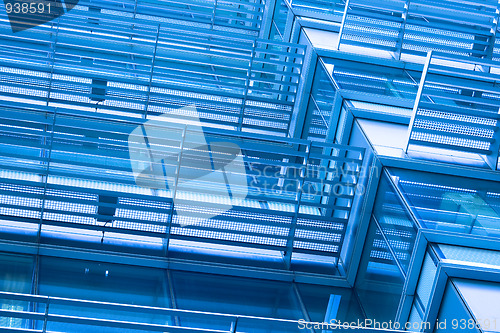 Image of Windows of modern building toned in blue color 