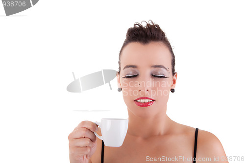 Image of beautiful young woman, taking and enjoying a coffee