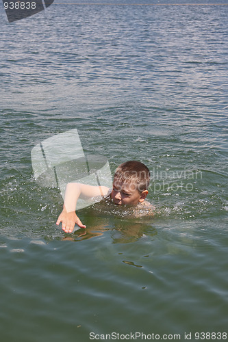 Image of Boy swimming in sea