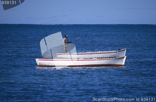 Image of Local boats with fisherman Mauritius Island