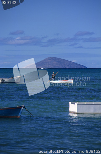 Image of Local boat with fisherman at Mauritius Island