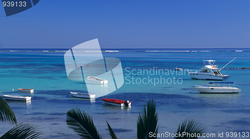 Image of Blue lagoon at Bain Beauf beach with boats