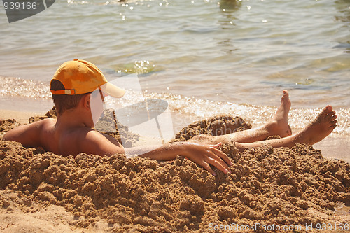 Image of Boy taking sun-bath