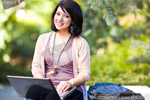 Image of Mixed race college student with laptop