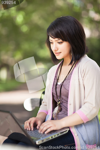Image of Mixed race college student with laptop