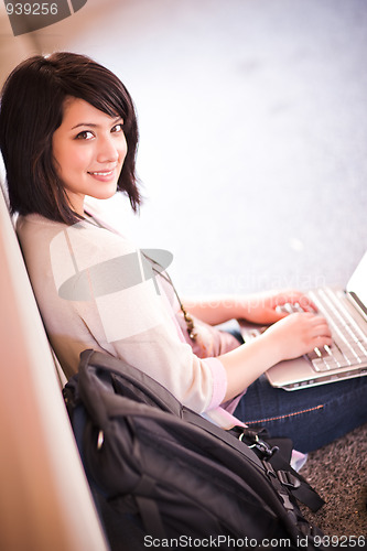Image of Mixed race college student with laptop