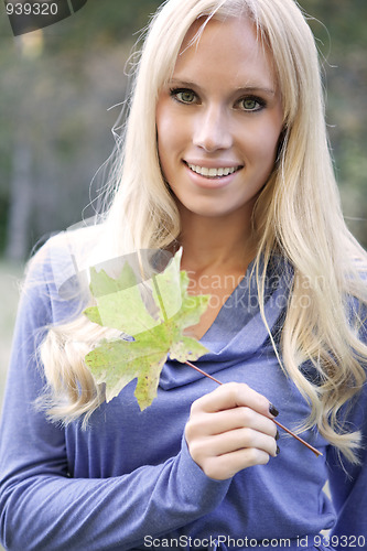 Image of Beautiful autumn woman