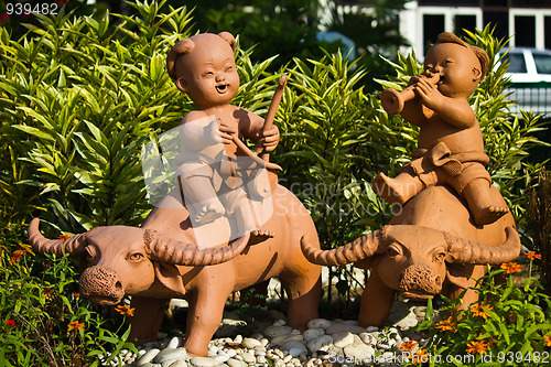 Image of earthenware childs and buffalo