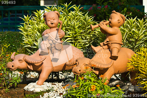 Image of earthenware childs and buffalo