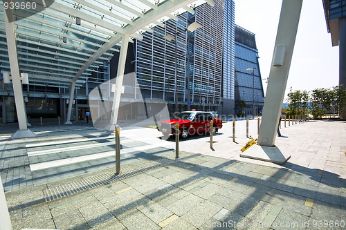 Image of taxi stop at zebra crossing at city