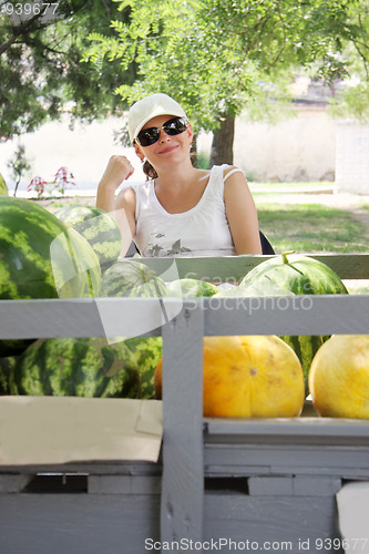 Image of Street melons vendor at counter