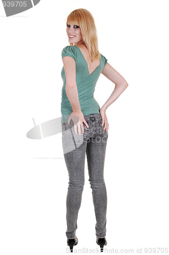 Image of Young girl holding her butt.