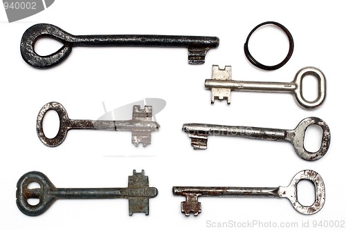 Image of six old rusty keys and keyring