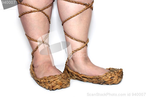 Image of peasant woman legs in russian bast shoes