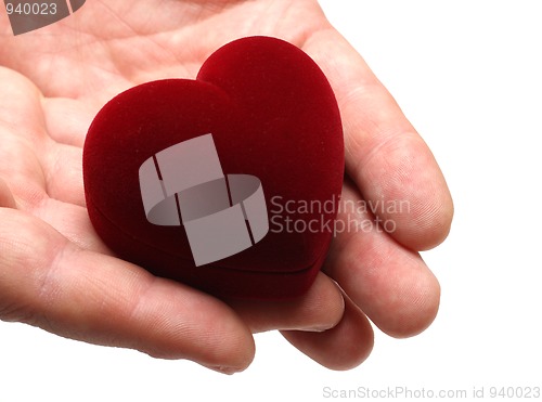 Image of man's hands gifting heart on valentine day
