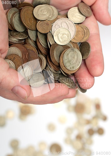 Image of money coins in woman hands