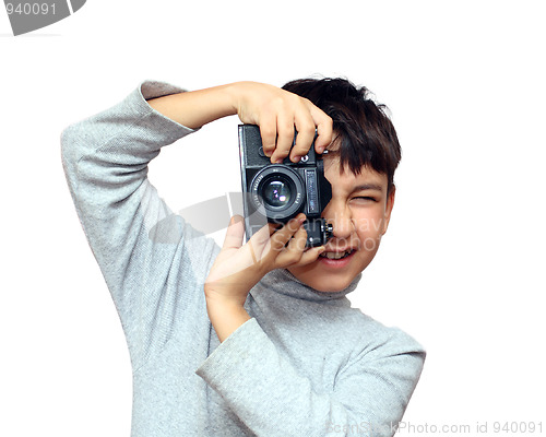 Image of boy photographing vertical with black slr camera