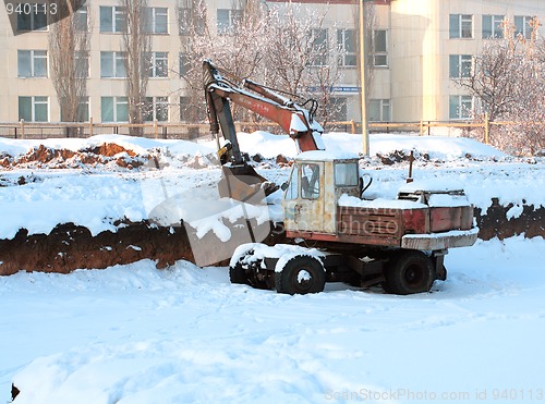 Image of excavator on deserted building