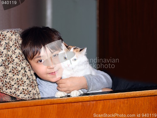 Image of asian boy with cat