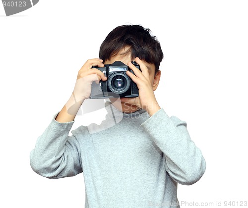 Image of boy photographing with black slr camera