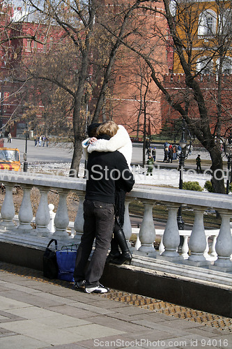 Image of kiss on streets of city