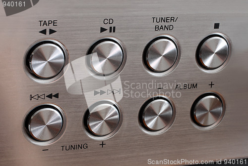 Image of metallic music control round buttons