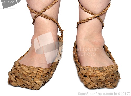 Image of woman legs in russian bast shoes