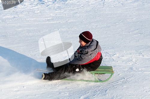 Image of happy boy on sledge