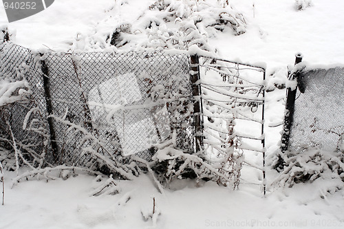 Image of gate and fence in snow