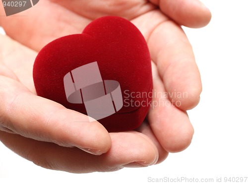 Image of man's hands gifting heart on valentine day