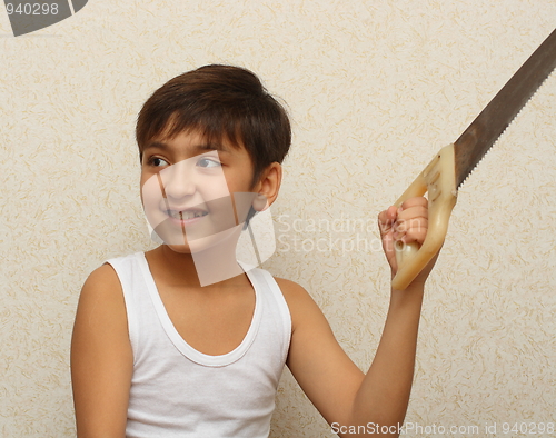 Image of smiling boy with saw