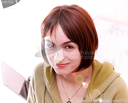 Image of Young woman in bed