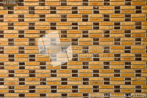 Image of Yellow and brown brick wall