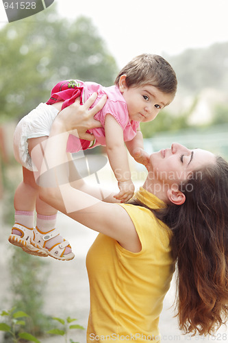 Image of Mother raising daughter