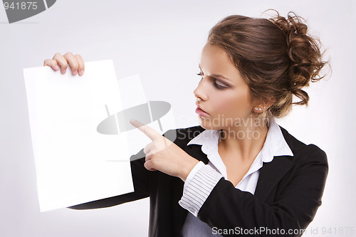 Image of Beautiful businesswoman with blank paper