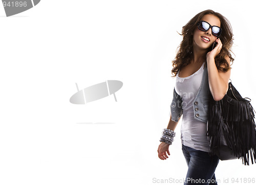 Image of Young teenage woman wearing sunglasses