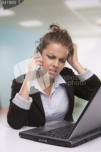 Image of Portrait of tired secretary working in office