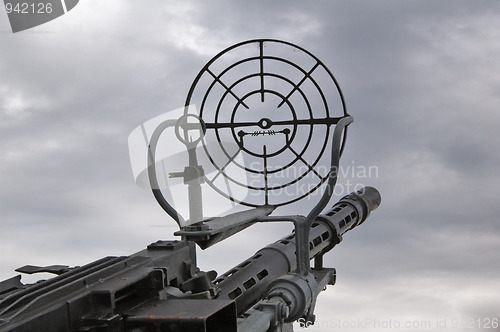 Image of Kind on the sky through a machine gun sight 