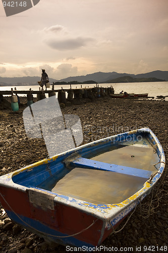 Image of fish boat and wood bridge