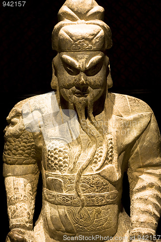 Image of chinese sculpture man in black background