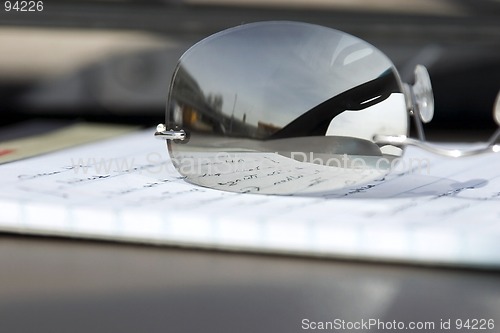 Image of Close up on the Glasses and the Notepad