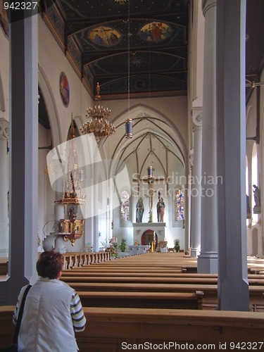 Image of Church in Germany with womans torso in foreground