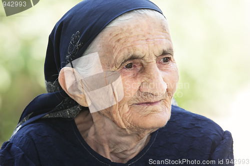 Image of Portrait of thoughtful elderly woman