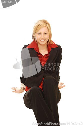 Image of Smiling sitting blond lady.