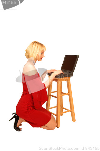 Image of Kneeling blond lady in red dress 