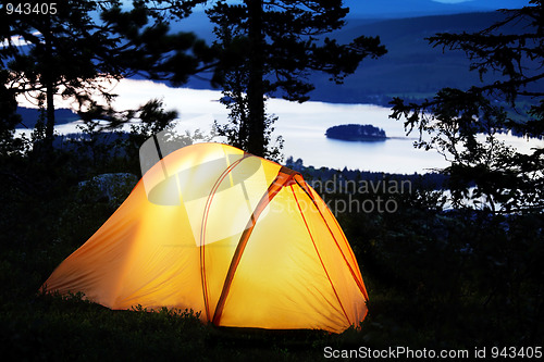 Image of Tent lit up at dusk