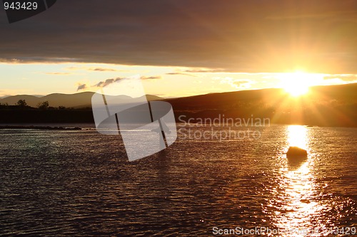 Image of Fisherman in beautiful sunset scenery