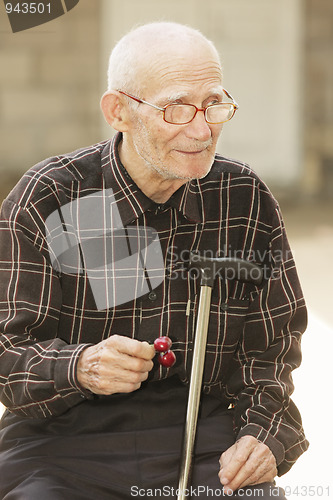 Image of Senior man with cherry