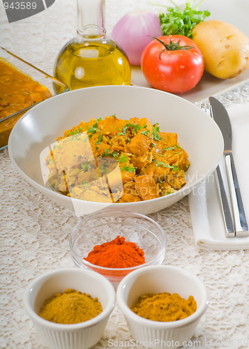 Image of curry beef rice and potatoes