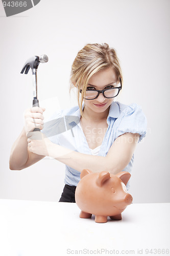 Image of breaking a piggy bank